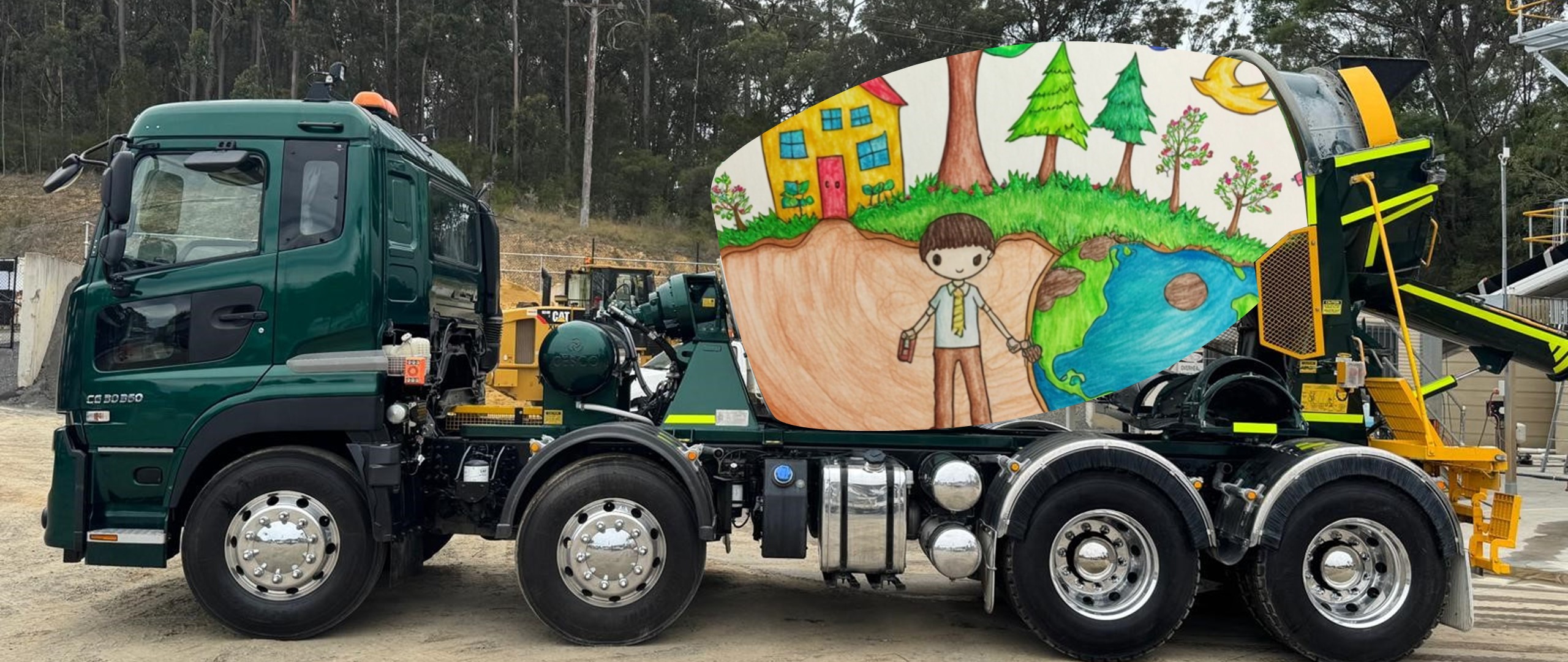 Stafford’s Green Concrete Truck with a vibrant mock-up of kids’ artwork wrapped around the barrel, showcasing colorful designs representing sustainability and community creativity.