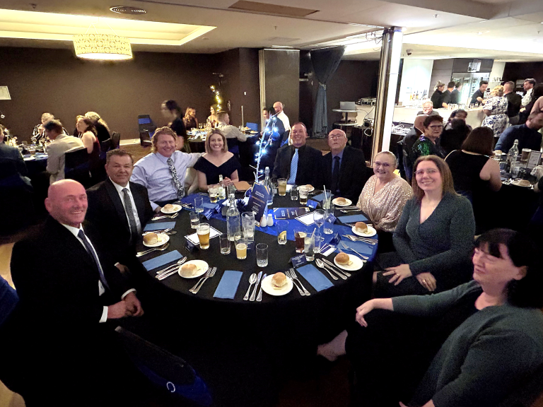Stafford’s team seated together at their table during the 2025 Bega Valley Business Awards dinner.