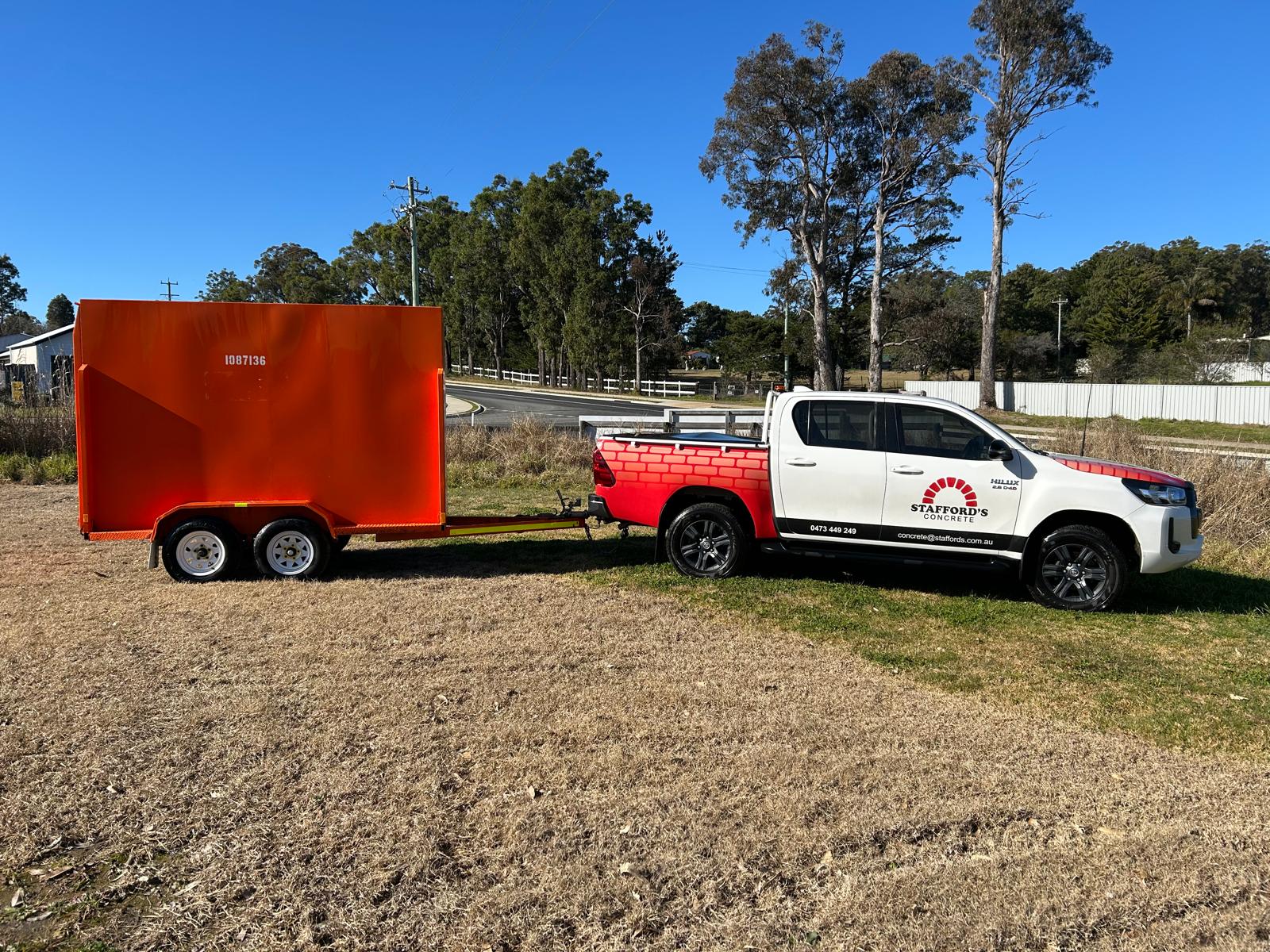 Stafford’s enclosed hire trailer hitched to a Stafford’s vehicle, ready for moving and transport in Kalaru.