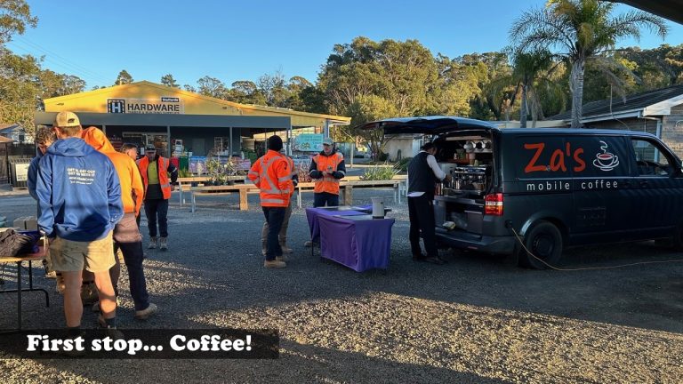 Tradies grabbing coffee from Za’s Mobile Coffee van at Stafford’s Kalaru Trade Brekkie outside the hardware store.