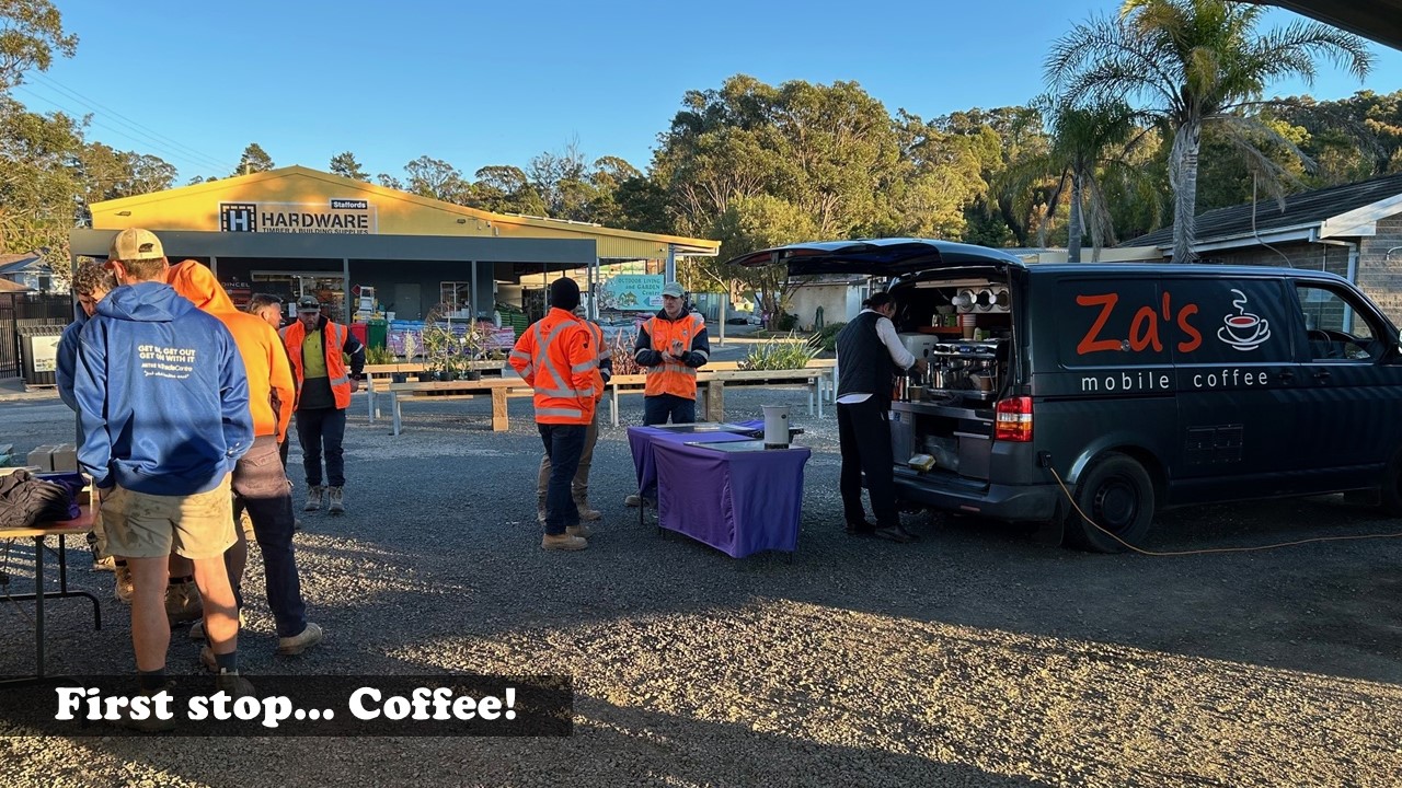 Tradies grabbing coffee from Za’s Mobile Coffee van at Stafford’s Kalaru Trade Brekkie outside the hardware store.